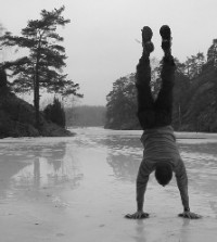 Soren does a handstand on the frozen lake